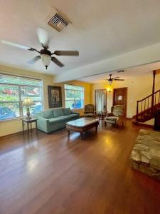 a living room with a couch and a table at Geneva Hotel & Tiki Bar in Lake Lure