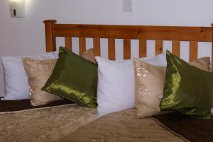 Säng eller sängar i ett rum på Emerald Guesthouse