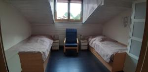 Llit o llits en una habitació de Ferienhaus Waterstrat