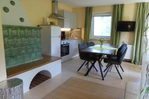 a kitchen and dining room with a table and chairs at Haus Daheim in St. Wolfgang