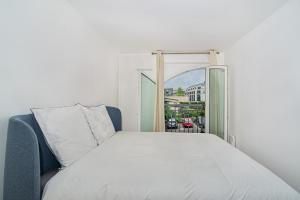 a bedroom with a bed and an open window at Disney and Paris * Netflix * Parking * 6 pers in Chessy