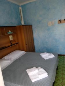 Voodi või voodid majutusasutuse Albergo Stella Di Mare toas