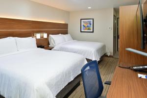 a hotel room with two beds and a television at Holiday Inn Express - Santa Rosa North by IHG in Santa Rosa