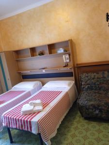 Voodi või voodid majutusasutuse Albergo Stella Di Mare toas