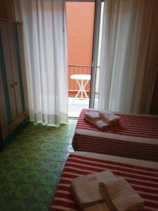 Voodi või voodid majutusasutuse Albergo Stella Di Mare toas