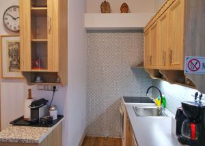 A kitchen or kitchenette at Royal Blue Grand Suite No 3