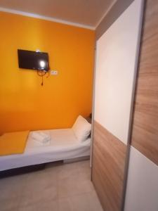 Postel nebo postele na pokoji v ubytování Apartment Flores centre
