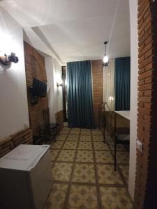A bed or beds in a room at Janashia Boutique Hotels