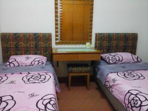 Cama o camas de una habitación en Homestay Serviced Apartment - Marina Court