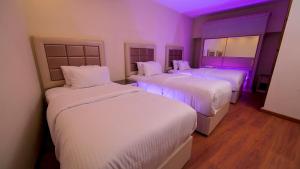 Postel nebo postele na pokoji v ubytování Villa 14 Suites