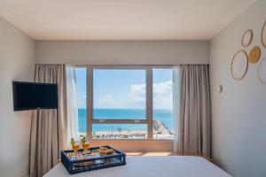 TV a/nebo společenská místnost v ubytování Praiano Hotel