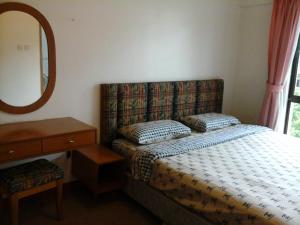 Postel nebo postele na pokoji v ubytování Homestay Serviced Apartment - Marina Court