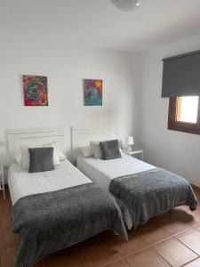 Posteľ alebo postele v izbe v ubytovaní Apartamento los Rostros