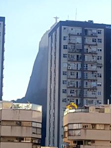 a building with a cross on top of it at Tudo proximo Botafogo in Rio de Janeiro