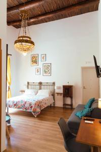 A bed or beds in a room at Relais CuoreNapoletano