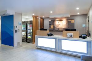 a waiting area in a store with boxes and a counter at Holiday Inn Express - Santa Rosa North by IHG in Santa Rosa