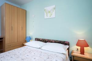En eller flere senge i et værelse på Apartments Zlata