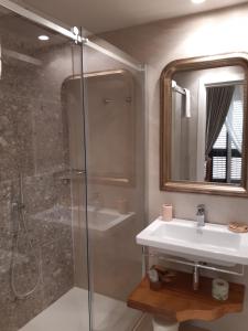 a bathroom with a shower and a sink and a mirror at Estlevante B&B in Vieste +37 photos