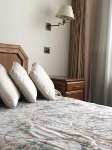 a hotel room with a bed with two pillows on it at B&B 518 in La Paz