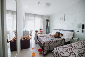 Postel nebo postele na pokoji v ubytování Hotel Gloria