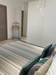 a living room with a bed and a table at Neptune in Francavilla al Mare