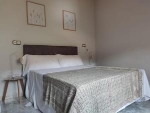 A bed or beds in a room at Playa de Raxó, al lado de Sanxenxo