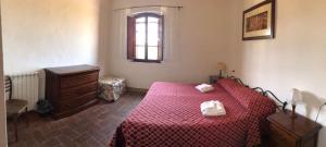 Posteľ alebo postele v izbe v ubytovaní Agriturismo Diffuso Monte Oliveto Maggiore