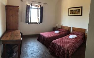 Posteľ alebo postele v izbe v ubytovaní Agriturismo Diffuso Monte Oliveto Maggiore