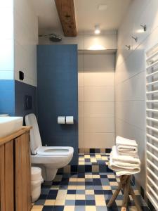 a bathroom with a toilet and a sink at 23 SouS in Amsterdam
