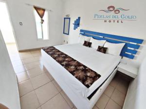 Katil atau katil-katil dalam bilik di Hotel Perlas del Golfo