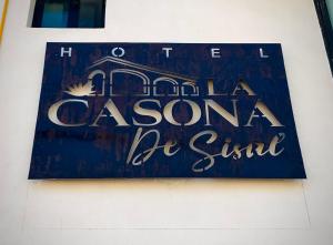 a sign for a casino be still on a wall at La Casona de Sisal Hotel in Sisal