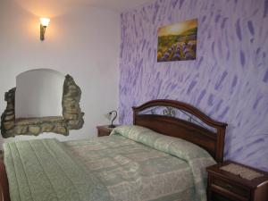 Postel nebo postele na pokoji v ubytování Agriturismo La Casa Vecchia