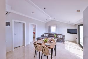 a living room with a table and a couch at Mare Vista Apart in Kaş
