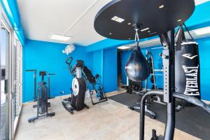 a gym with bikes and exercise equipment in a room at Waikiki Beach Condominiums in Honolulu