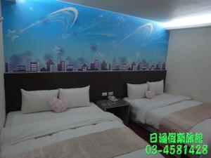 Un pat sau paturi într-o cameră la Ryhan Hotel
