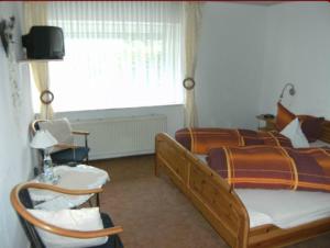 Postel nebo postele na pokoji v ubytování Pension Haus Butz