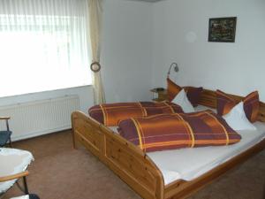 Postel nebo postele na pokoji v ubytování Pension Haus Butz