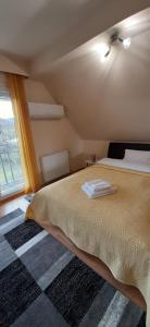 Posteľ alebo postele v izbe v ubytovaní NAPKŐ APARTMAN