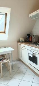 Kuchyňa alebo kuchynka v ubytovaní NAPKŐ APARTMAN