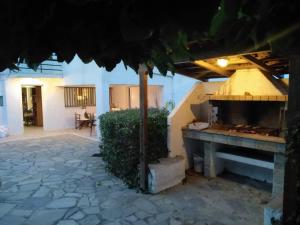 a patio with a pizza oven in a building at Ellina's Home - Euboea island Greece in Oxílithos