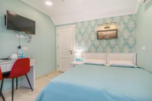 Postel nebo postele na pokoji v ubytování Nicolas Boutique Hotel