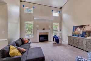 a living room with a couch and a fireplace at Incredibly Spacious Carmel Home with Fully Equipped Kitchen - 4700 Sq Ft! Sleeps 15! Pet Friendly! home in Carmel +22 photos