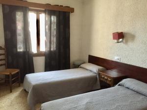 Posteľ alebo postele v izbe v ubytovaní Les Roches