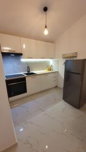 Kuchyňa alebo kuchynka v ubytovaní Apartman Volme