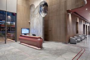 a lobby with a statue of a woman on the wall at Melas Hotel Istanbul in Istanbul