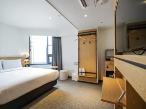 Krevet ili kreveti u jedinici u okviru objekta Henn na Hotel Seoul Myeongdong