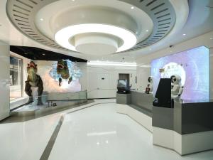 a museum with a dog statue and a large screen at Henn na Hotel Seoul Myeongdong in Seoul