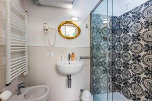 a bathroom with a sink and a shower at San Giovanni in Finale Ligure