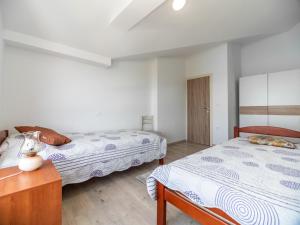 Posteľ alebo postele v izbe v ubytovaní Berat Apartment