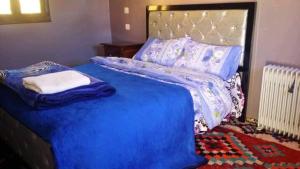 Letto o letti in una camera di Gite Dar Tanzoughte